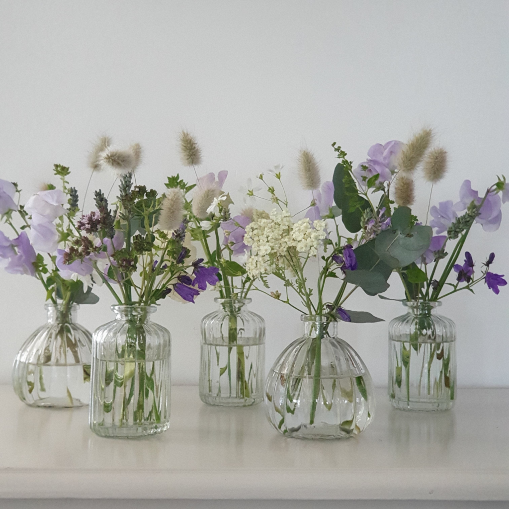 Bud Vases with Fresh Flowers such as baby's breath